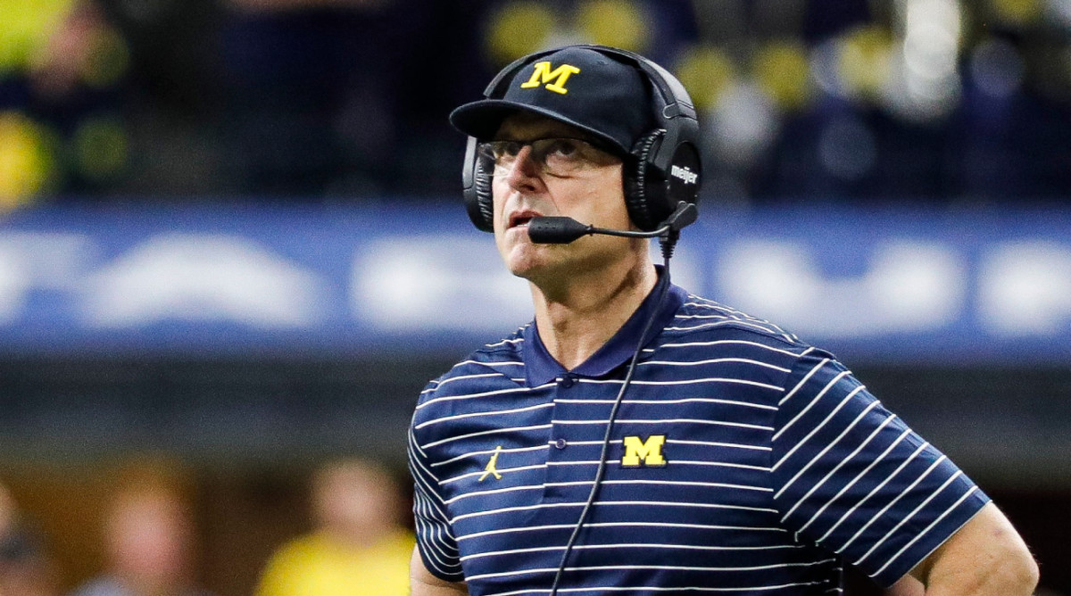 Michigan coach Jim Harbaugh stands on the sidelines during the 2022 Big Ten championship game.