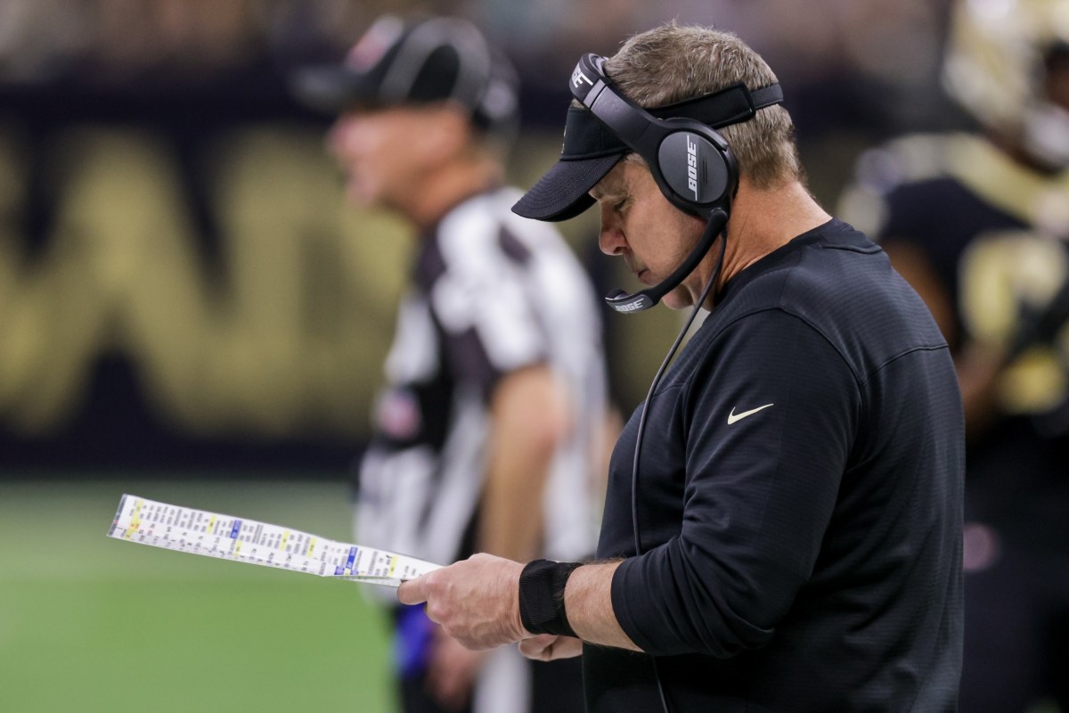 Dec 27, 2021; New Orleans Saints head coach Sean Payton looks at his call sheet against Miami Dolphins. Mandatory Credit: Stephen Lew-USA TODAY Sports