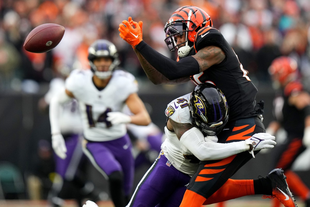 Jan 8, 2023; Cincinnati, Ohio, USA; Baltimore Ravens cornerback Daryl Worley (41) delivers a hit on Cincinnati Bengals wide receiver Tee Higgins (85) in the fourth quarter during a game at Paycor Stadium. The Cincinnati Bengals won, 27-16.