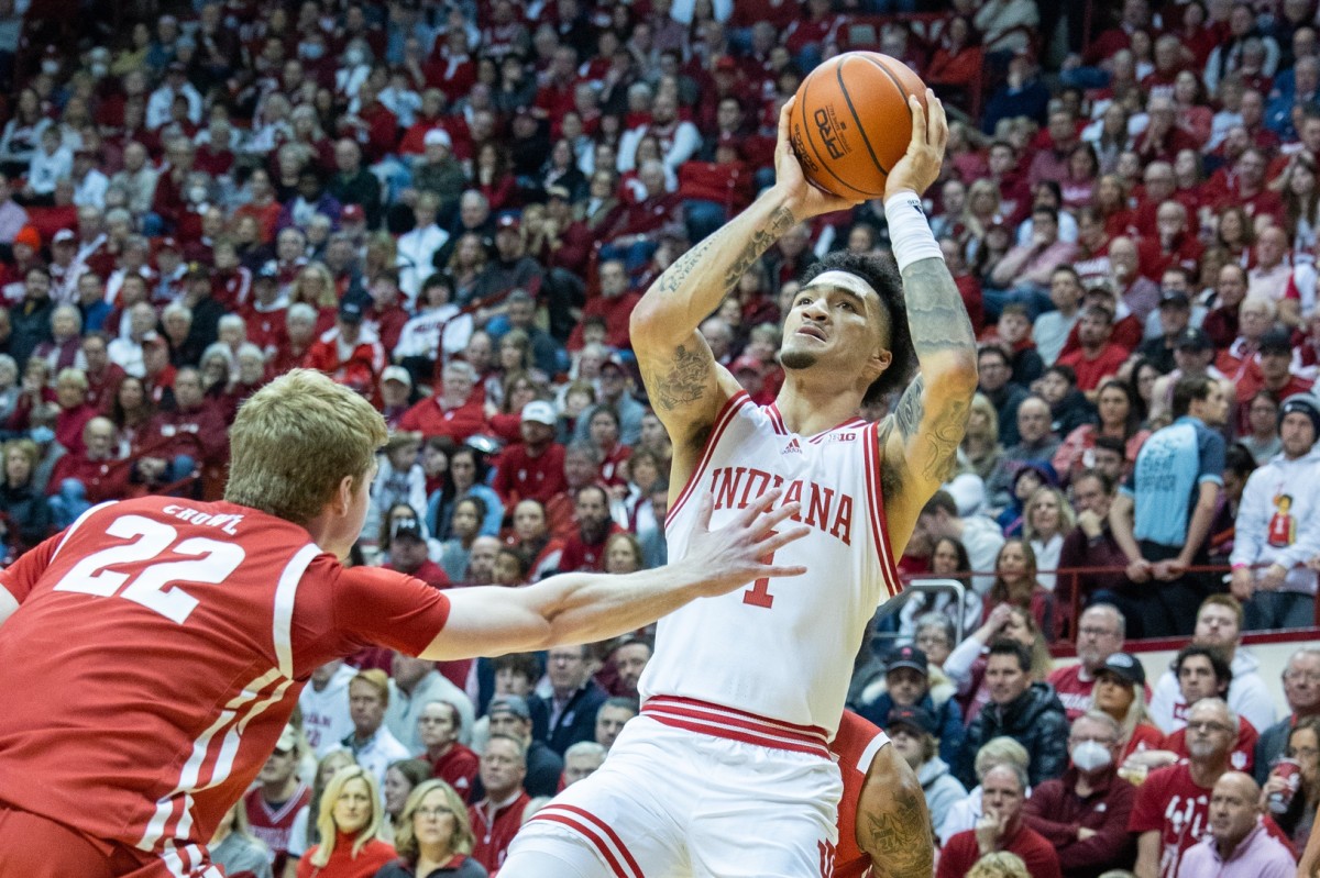 Indiana Hoosiers guard Jalen Hood-Schifino (1) shoots the ball while Wisconsin Badgers forward Steven Crowl (22) defends in the first half at Simon Skjodt Assembly Hall