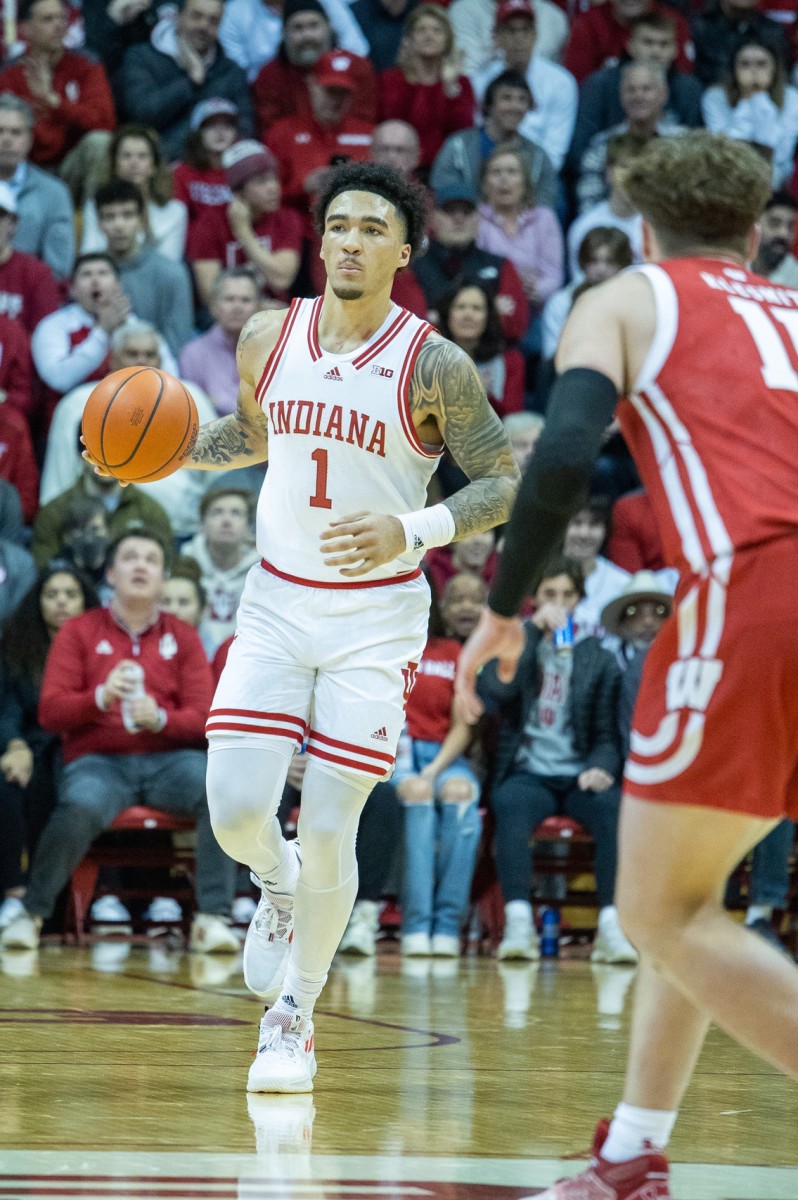 Indiana Hoosiers guard Jalen Hood-Schifino (1) dribbles the ball while Wisconsin Badgers guard Max Klesmit (11) defends in the first half at Simon Skjodt Assembly Hall.