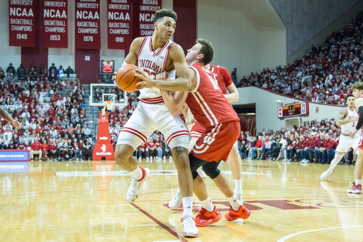 Indiana Hoosiers forward Trayce Jackson-Davis (23) shoots the ball while Wisconsin Badgers forward Carter Gilmore (14) defends.