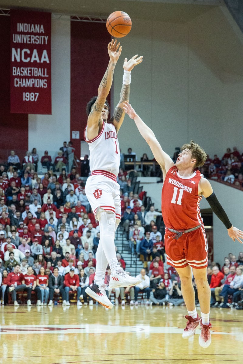 Indiana Hoosiers guard Jalen Hood-Schifino (1) shoots the ball while Wisconsin Badgers guard Max Klesmit (11) defends in the first half at Simon Skjodt Assembly Hall.