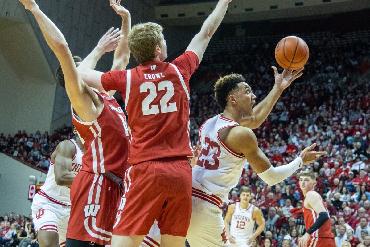 Indiana Hoosiers forward Trayce Jackson-Davis (23) shoots the ball while Wisconsin Badgers forward Steven Crowl (22) defends in the first half at Simon Skjodt Assembly Hall.