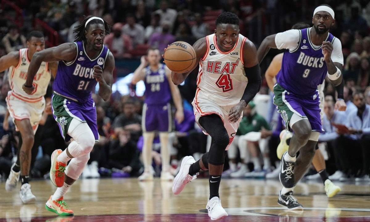 Miami Heat guard Victor Oladipo (4) breaks free on a turnover against Milwaukee Bucks guard Jrue Holiday (21) and forward Bobby Portis (9)