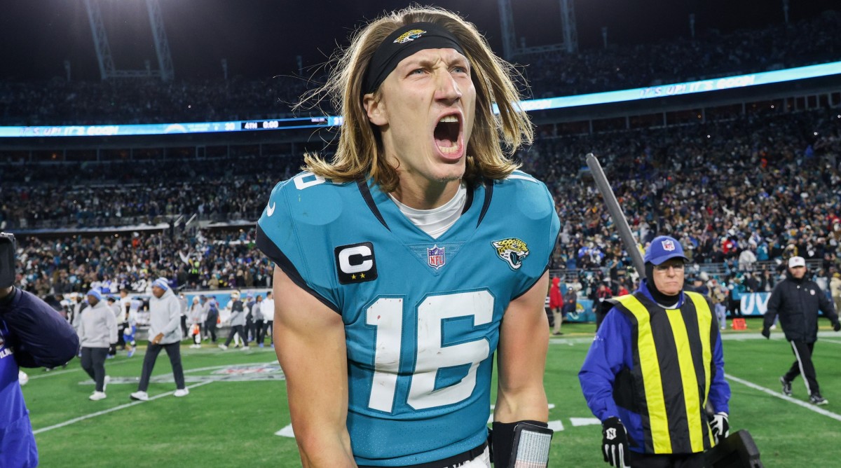 Jaguars quarterback Trevor Lawrence (16) celebrates after beating the Chargers in an AFC wild-card playoff game.