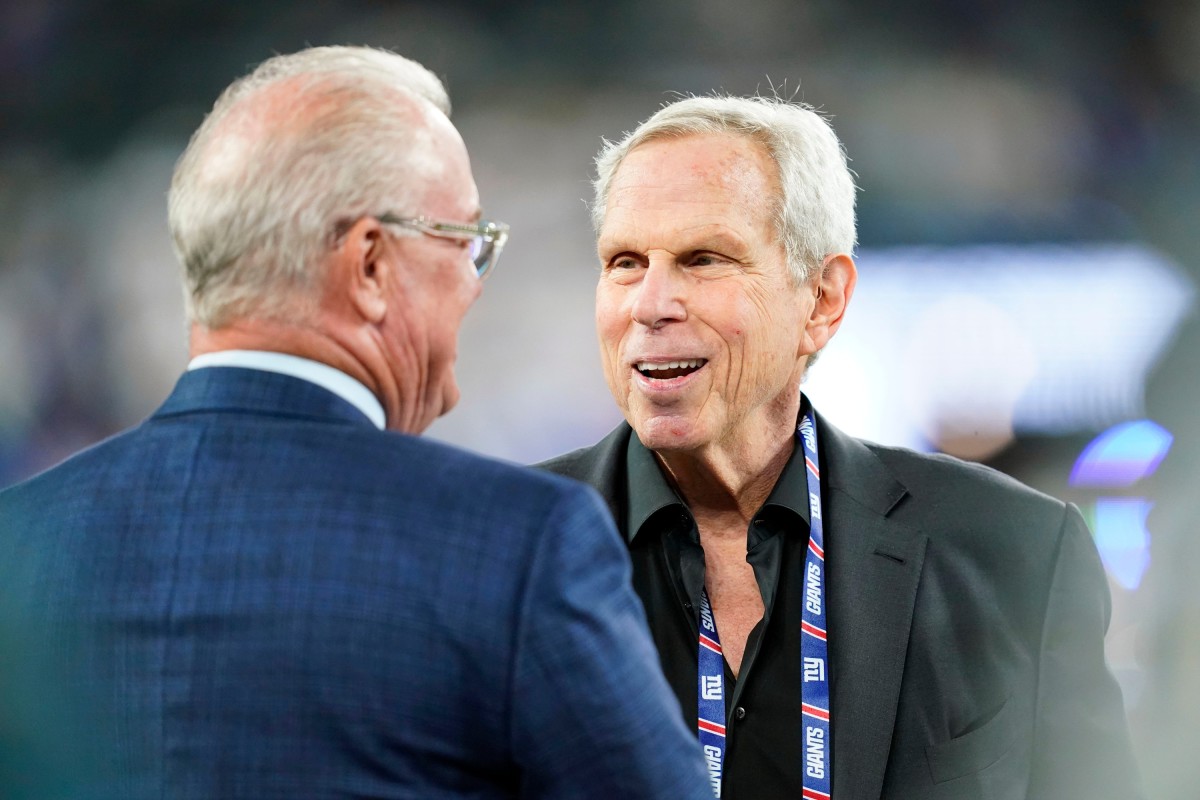 New York Giants co-owner Steve Tisch, right, on the field before the Giants face the Dallas Cowboys at MetLife Stadium on Monday, Sept. 26, 2022.
