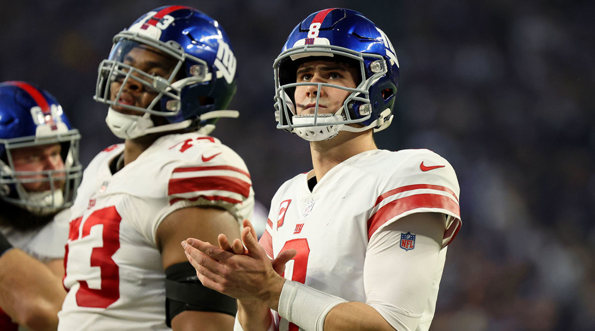 Daniel Jones claps during a wild-card win over the Vikings.