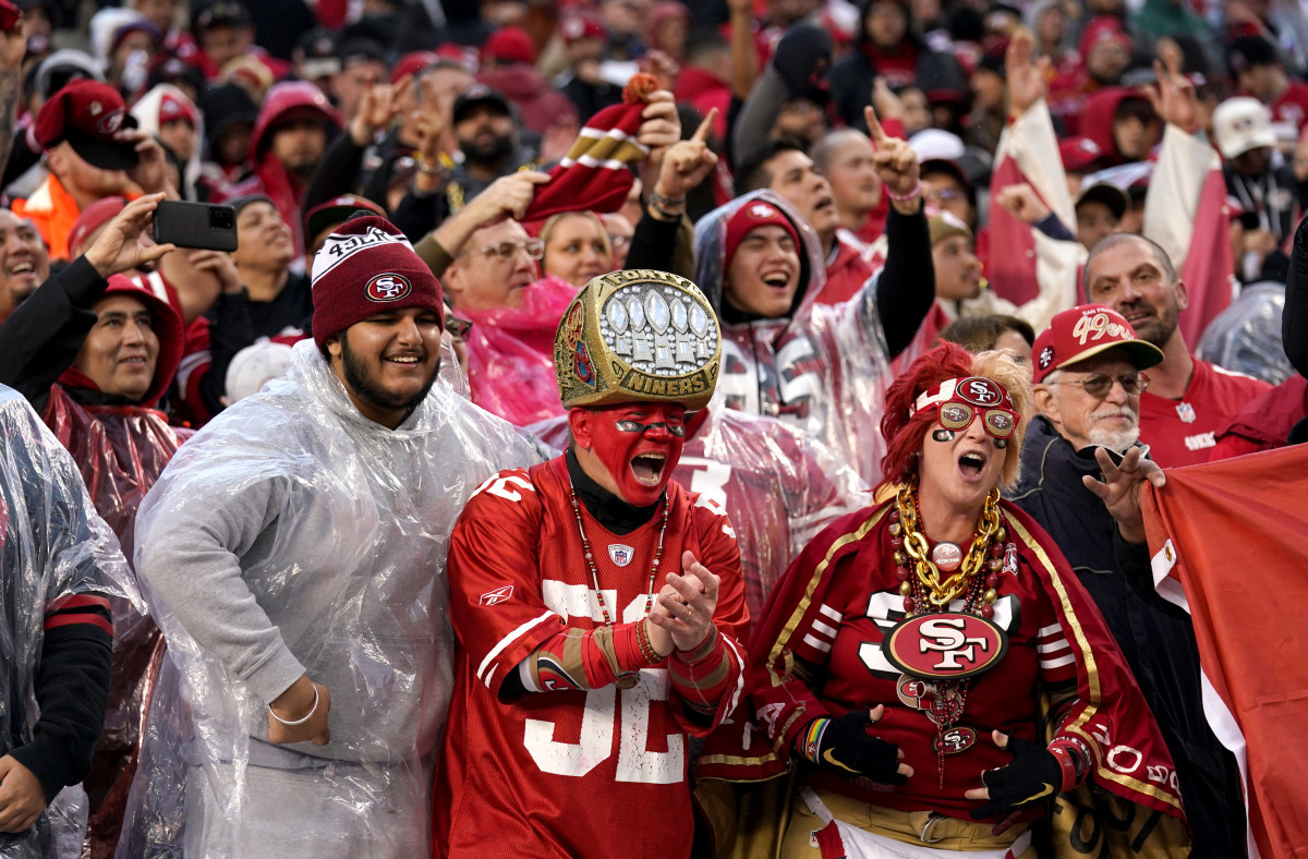 49ers fans cheer in the rain during San Francisco's playoff win over the Seahawks