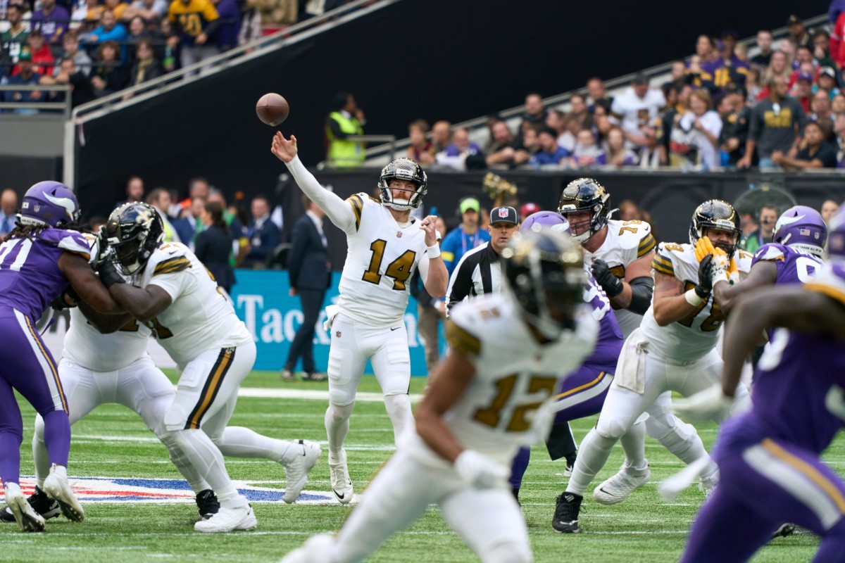 Oct 2, 2022; New Orleans Saints quarterback Andy Dalton (14) throws the ball against the Minnesota Vikings. Mandatory Credit: Peter van den Berg-USA TODAY Sports