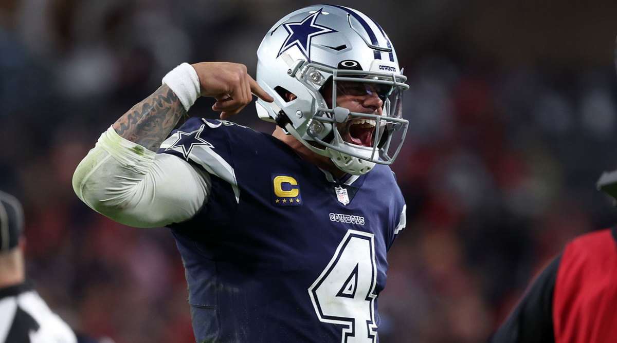 Dak Prescott celebrates after a touchdown pass against the Buccaneers in the playoffs.