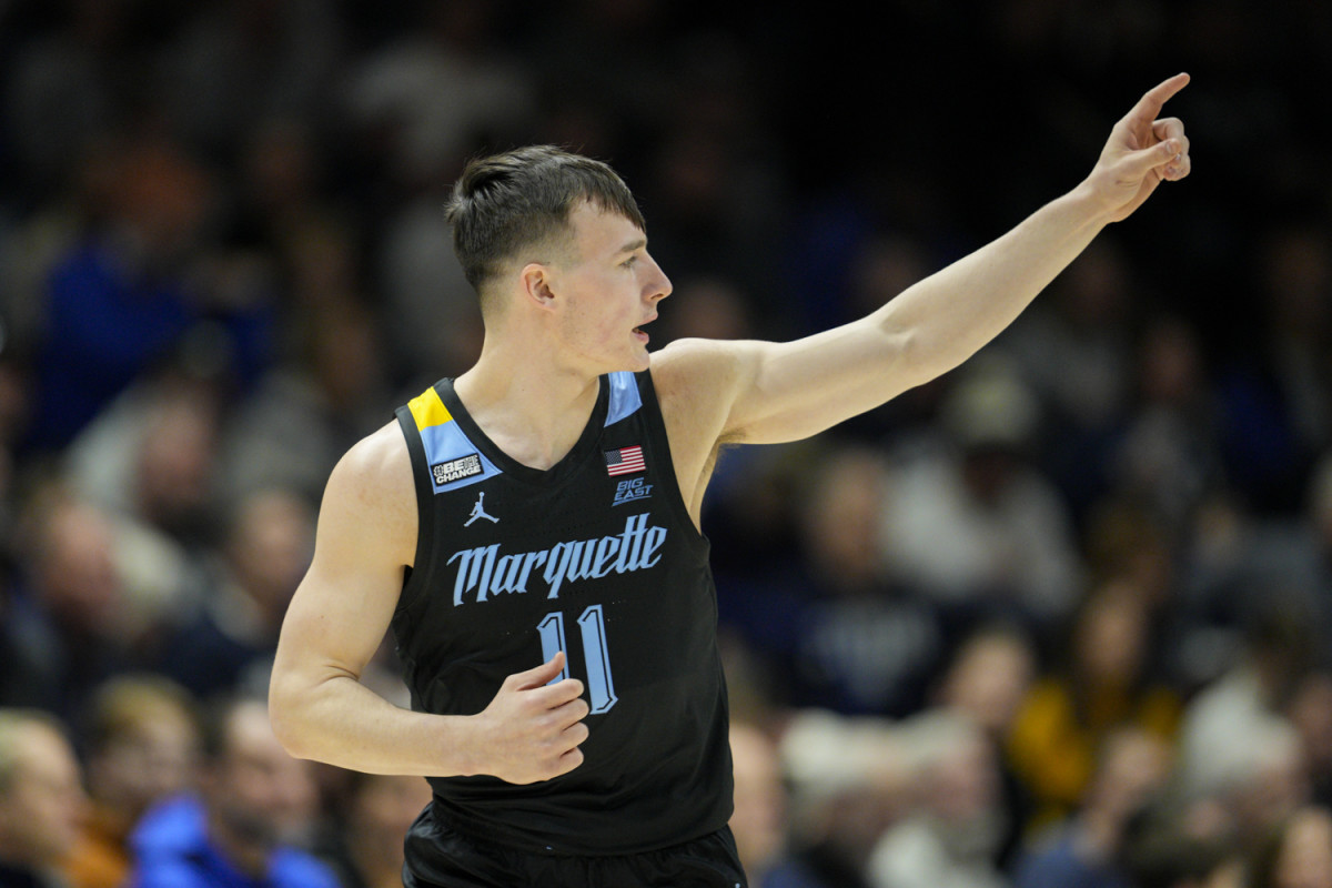 Marquette guard Tyler Kolek (11) reacts after scoring during the first half of an NCAA college basketball game against Xavier, Sunday, Jan. 15, 2023, in Cincinnati.