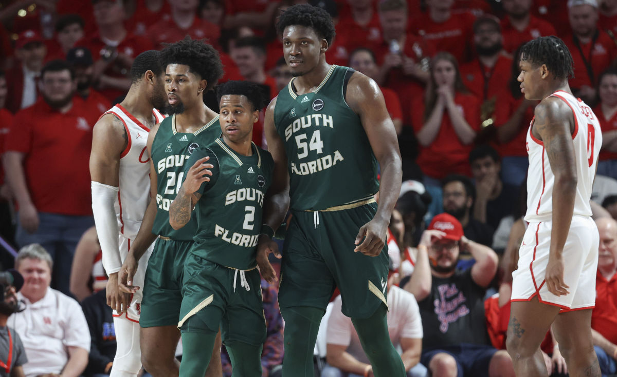 Jan 11, 2023; Houston, Texas, USA; South Florida Bulls center Russel Tchewa (54) and guard Tyler Harris (2) react during the second half against the Houston Cougars at Fertitta Center. Mandatory Credit: Troy Taormina-USA TODAY Sports