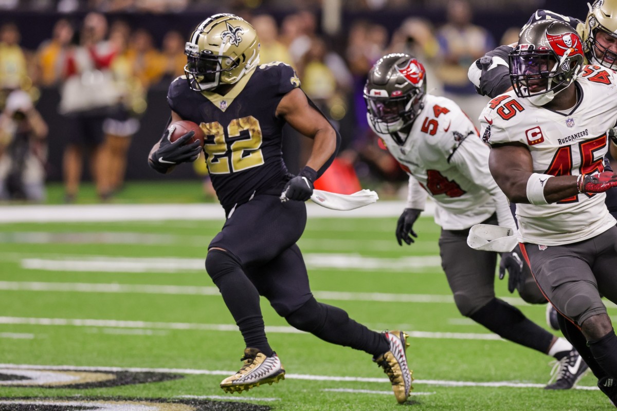 Sep 18, 2022; New Orleans Saints running back Mark Ingram II (22) rushes against Tampa Bay Buccaneers linebackers Lavonte David (54) and Devin White (45). Mandatory Credit: Stephen Lew-USA TODAY Sports