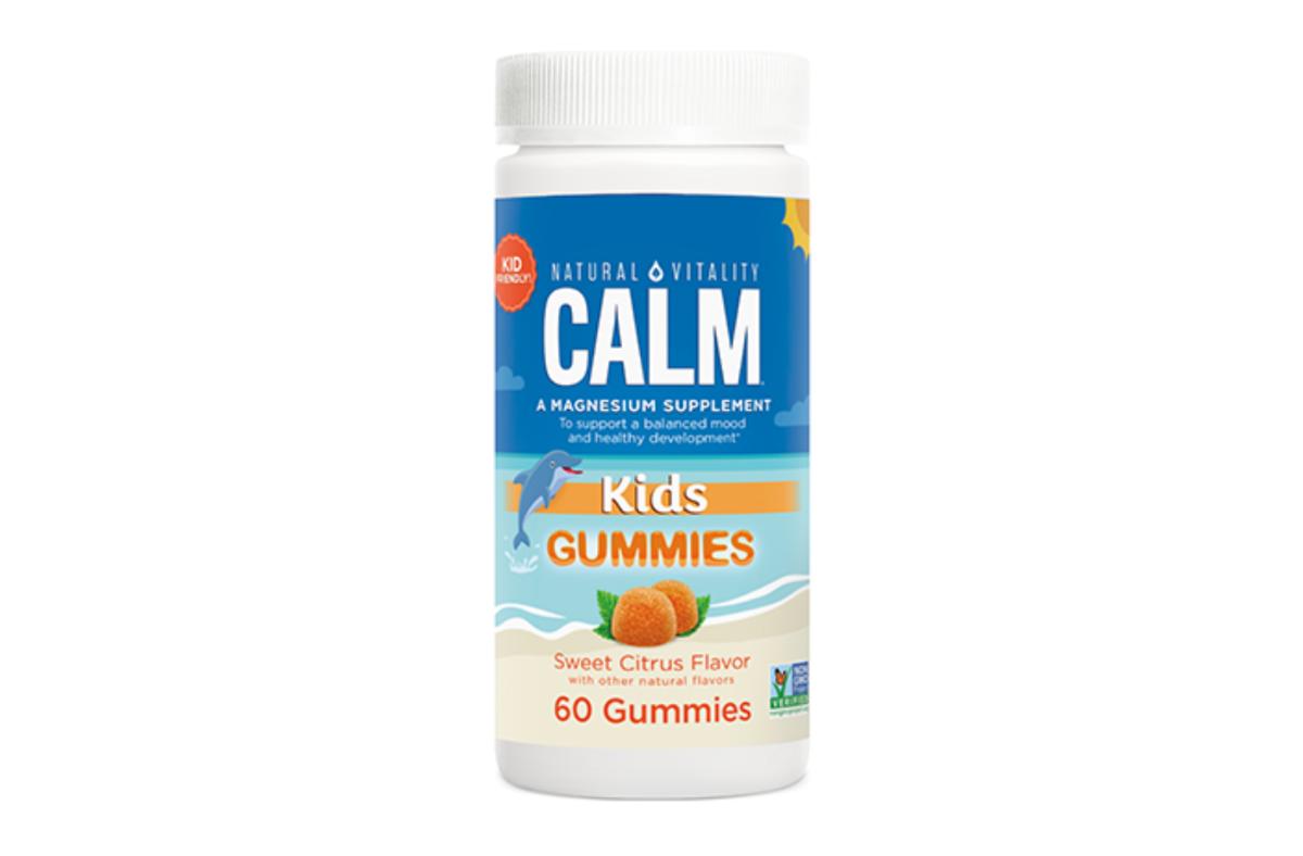 A container of Natural Vitality Calm Kids Gummies in Sweet Citrus flavor against a white backround.