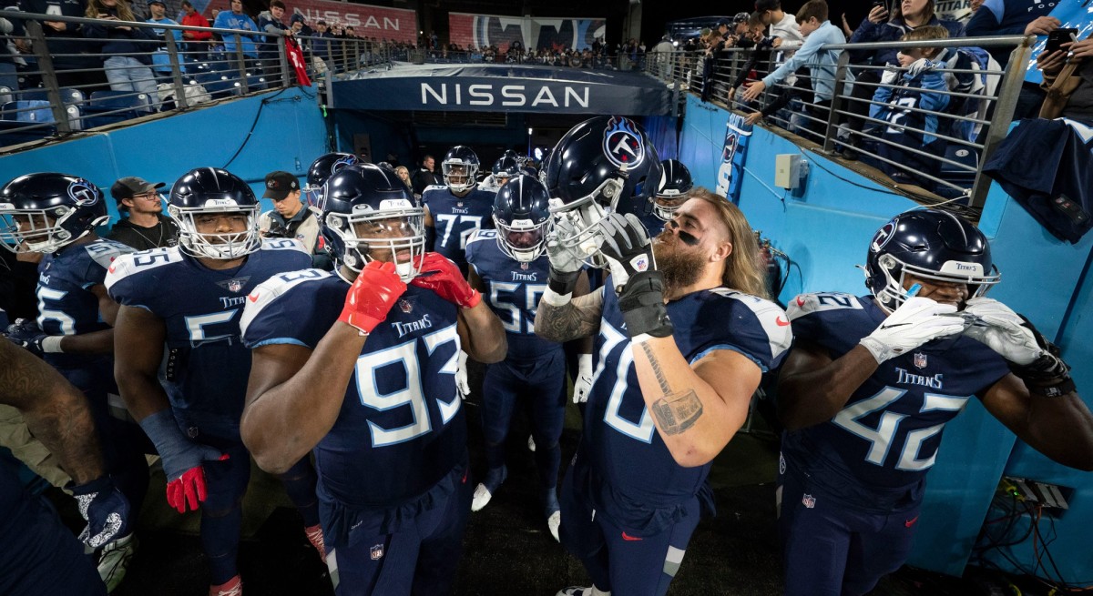 Tennessee Titans offensive and defensive lineman huddle in the tunnel before the game against the Dallas Cowboys at Nissan Stadium Thursday, Dec. 29, 2022, in Nashville, Tenn.