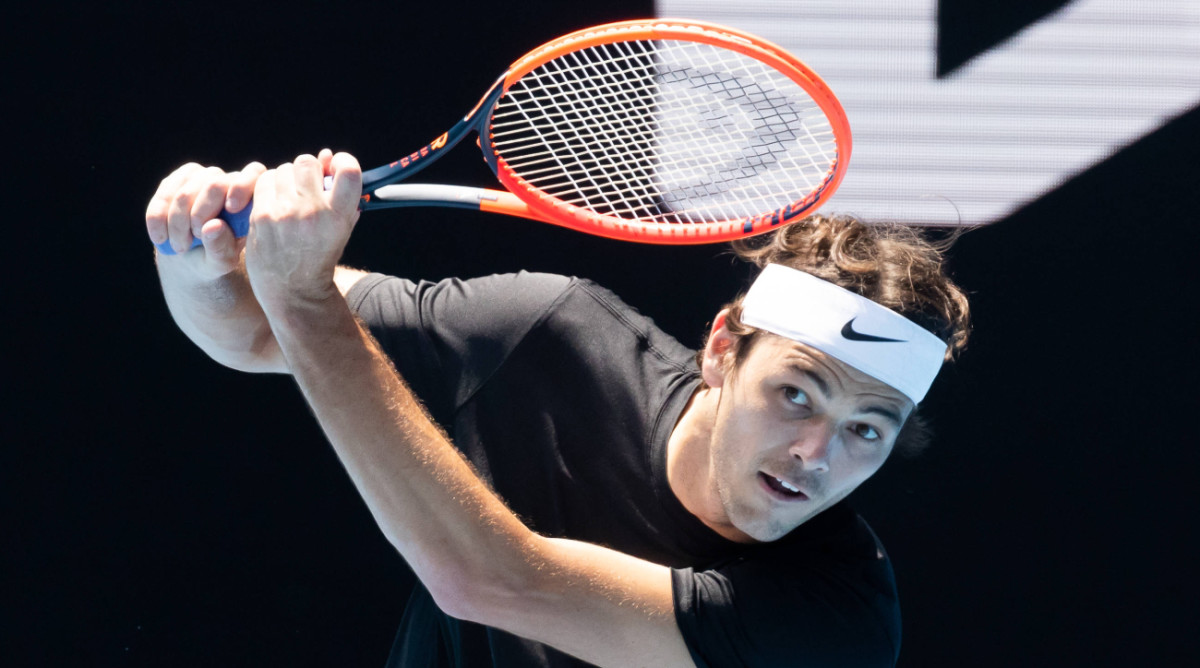 American tennis player Taylor Fritz warms up for the 2023 Australian Open.