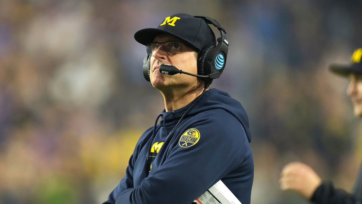 Michigan coach Jim Harbaugh looks up on the sideline