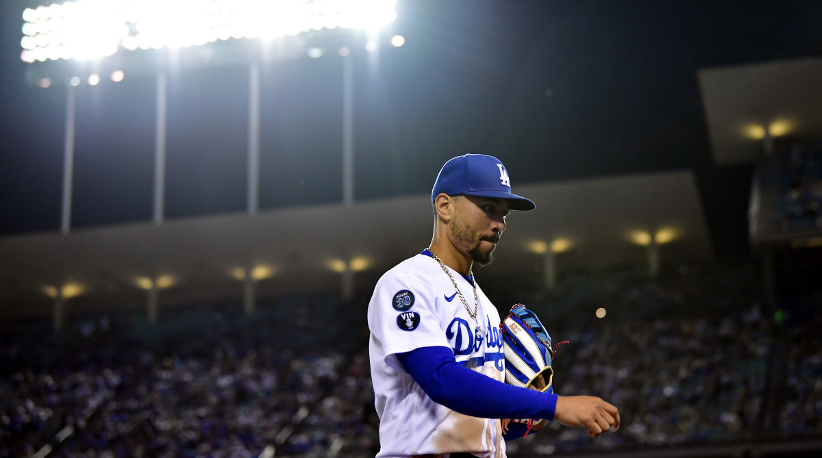 Dodgers outfielder Mookie Betts walks off the field.