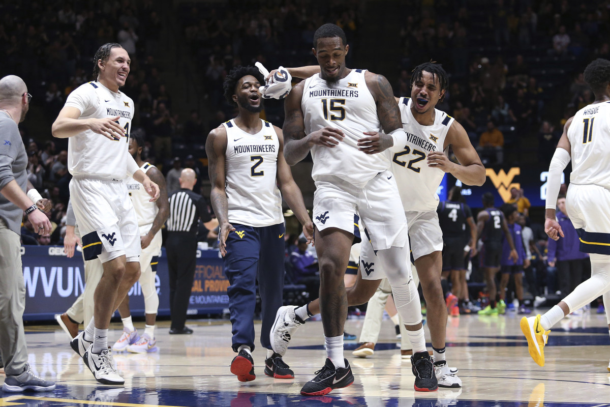 West Virginia players celebrate during the first half of the team's NCAA college basketball game against TCU on Wednesday, Jan. 18, 2023, in Morgantown, W.Va