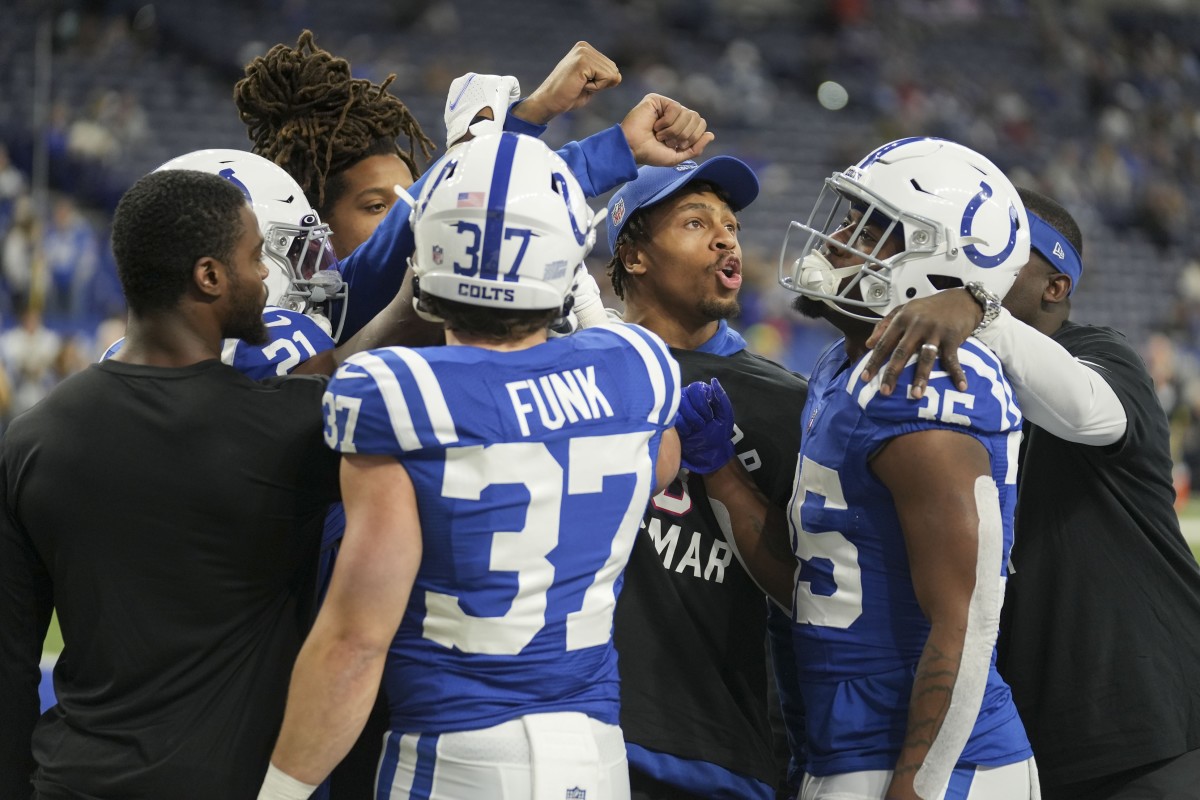 Indianapolis Colts players including Indianapolis Colts running back Jonathan Taylor (28) huddle up Sunday, Jan. 8, 2023, before a game against the Houston Texans at Lucas Oil Stadium.