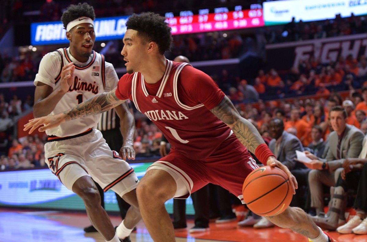 Indiana Hoosiers guard Jalen Hood-Schifino (1) drives the ball past Illinois Fighting Illini guard Sencire Harris (1) during the second half at State Farm Center.