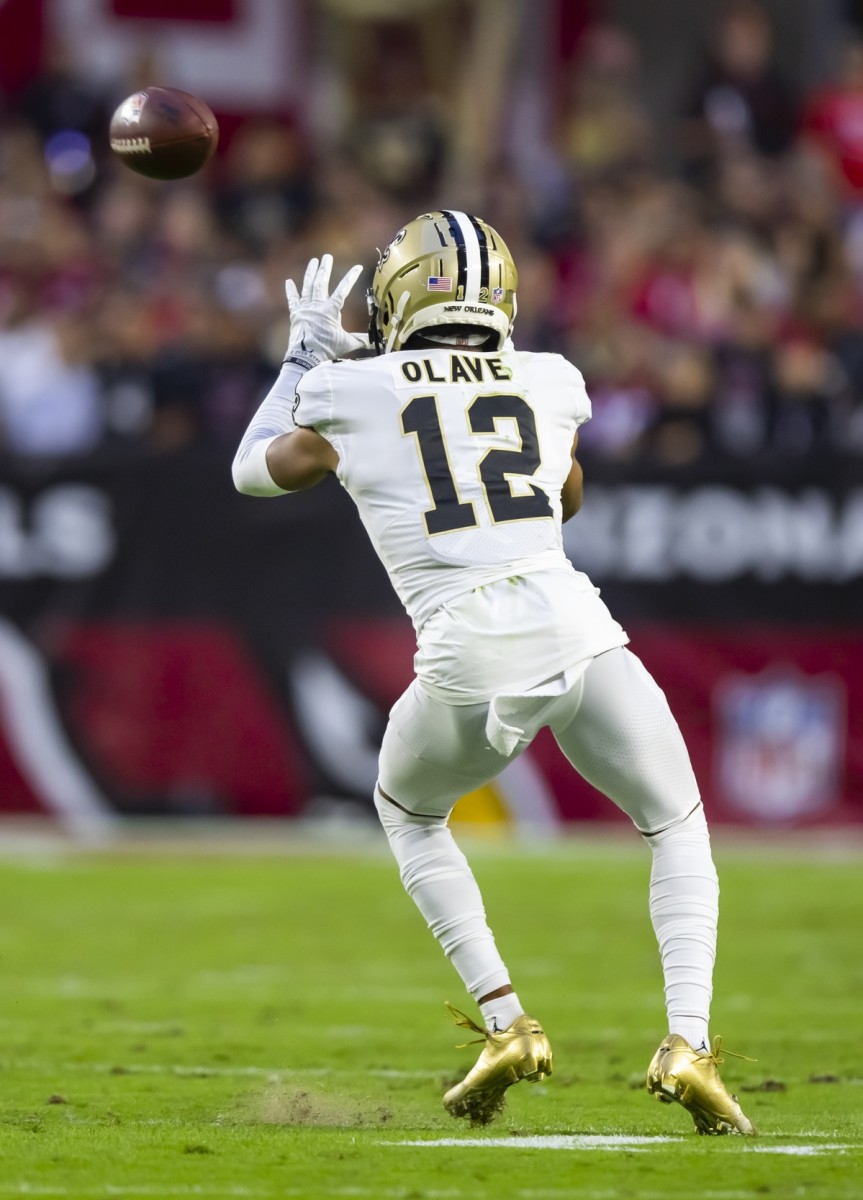 New Orleans Saints receiver Chris Olave (12) catches a pass against the Arizona Cardinals. Mandatory Credit: Mark J. Rebilas-USA TODAY Sports