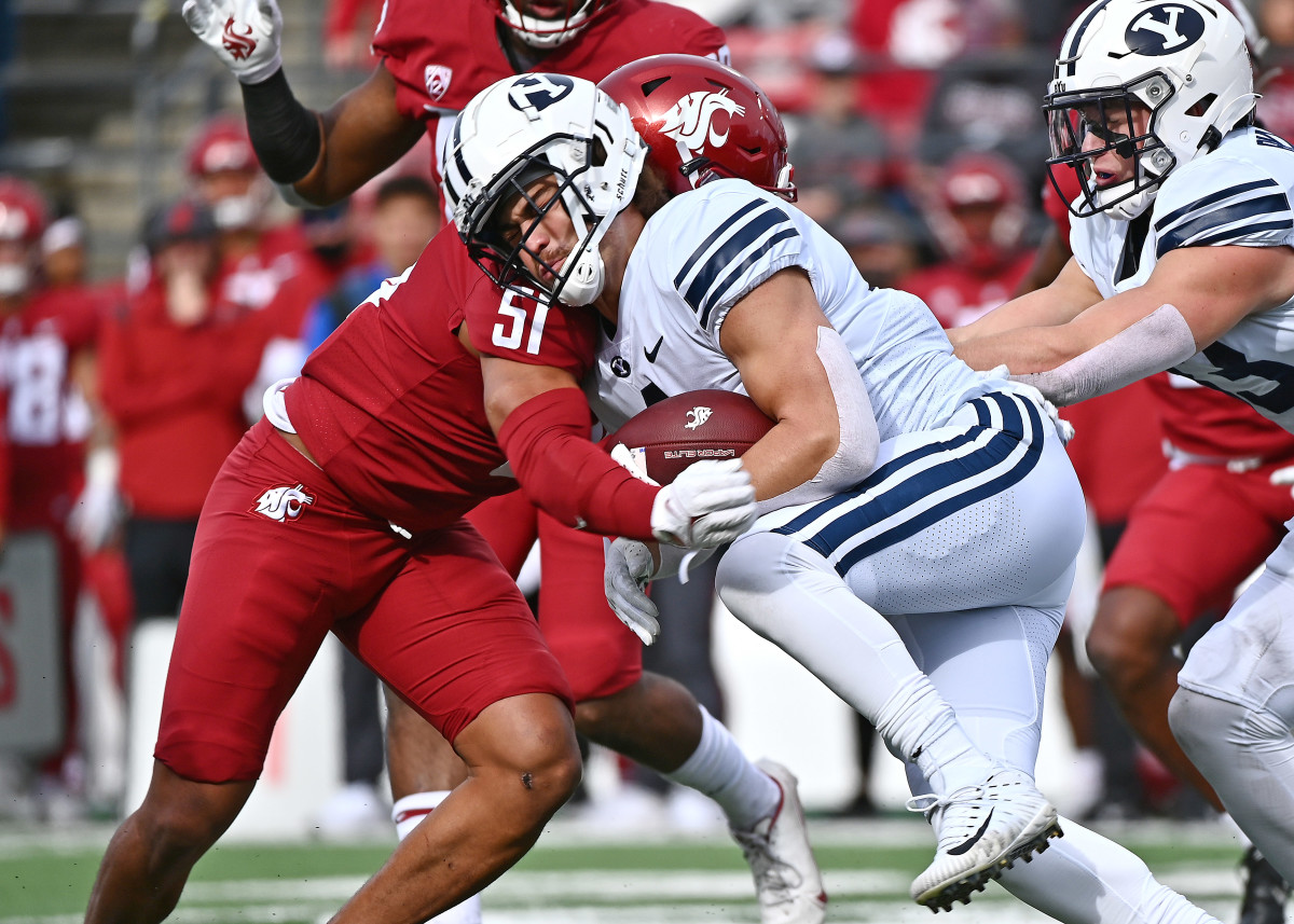 Pullman, Washington, USA; Brigham Young Cougars running back Lopini Katoa (4) is stopped on the return by Washington State Cougars linebacker Francisco Mauigoa (51) in the first half at Gesa Field at Martin Stadium.