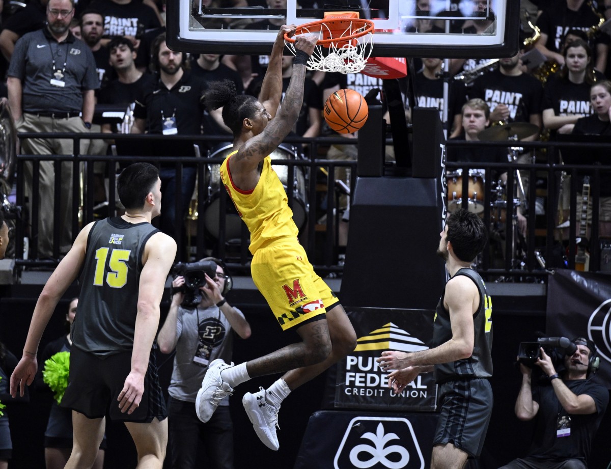 Jan 22, 2023; West Lafayette, Indiana, USA; Maryland Terrapins forward Julian Reese (10) dunks the ball between Purdue Boilermakers center Zach Edey (15) and guard Ethan Morton (25) during the second half at Mackey Arena.