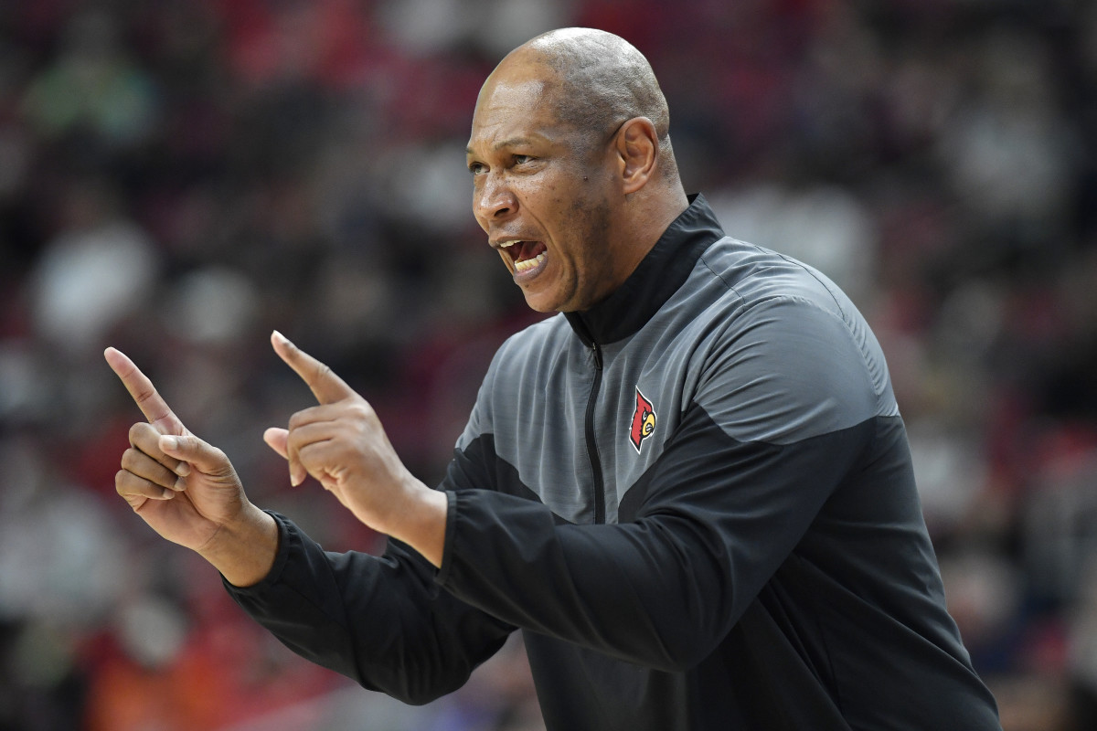 Kenny Payne yells out a play to his Louisville players.