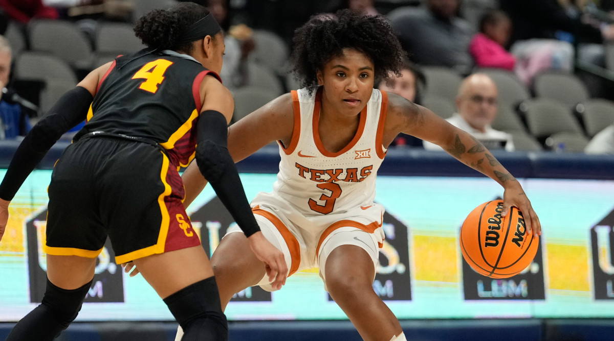 Longhorns guard Rori Harmon (3) controls the ball against USC Trojans guard Kayla Williams.