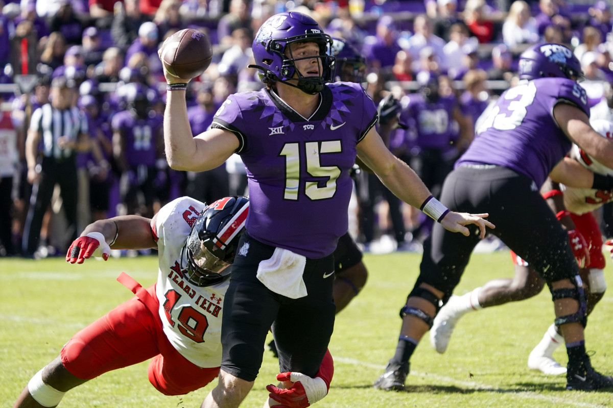 Fort Worth, Texas, USA; TCU Horned Frogs quarterback Max Duggan (15) avoids the pressure of Texas Tech Red Raiders linebacker Tyree Wilson (19) during the second half of a game at Amon G. Carter Stadium.