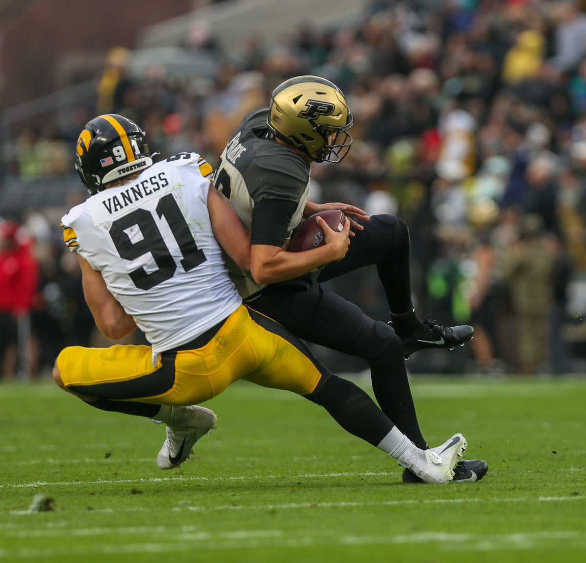 Iowa Hawkeyes defensive lineman Lukas Van Ness (91) sacks Purdue Boilermakers quarterback Aidan O'Connell (16) during the NCAA football game against the Purdue Boilermakers, Saturday, Nov. 5, 2022, at Ross-Ade Stadium in West Lafayette, Ind. Np1 1076