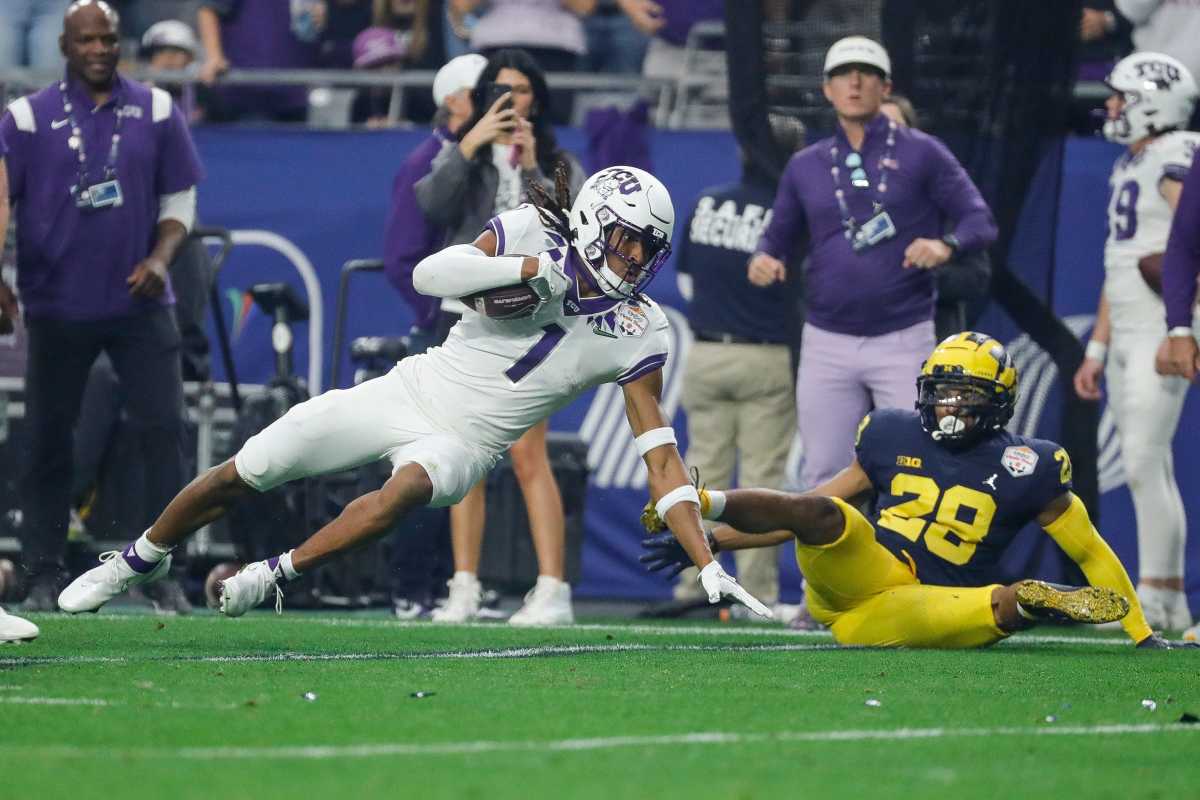 CU wide receiver Quentin Johnston (1) makes catch against Michigan defensive back Quinten Johnson (28) during the first half at the Fiesta Bowl at State Farm Stadium in Glendale, Ariz. on Saturday, Dec. 31, 2022.