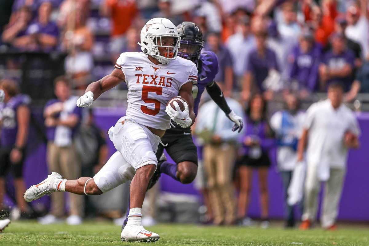 Texas running back Bijan Robinson (5) runs the ball. Texas took on Texas Christian University at Amon G. Carter Stadium in Fort Worth, Texas on Oct. 2, 2021