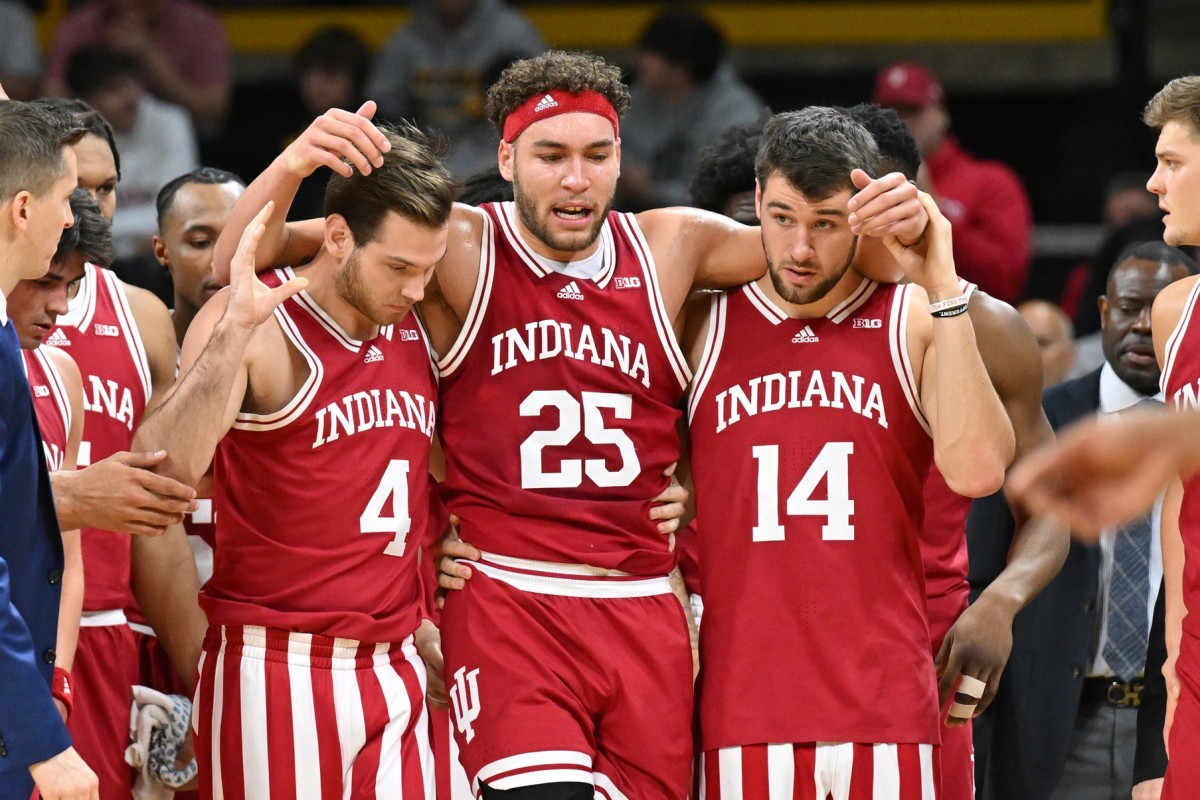Indiana Hoosiers forward Race Thompson (25) walks off the court with forward Nathan Childress (14) and guard Michael Shipp (4) after an injury during the first half against the Iowa Hawkeyes at Carver-Hawkeye Arena.