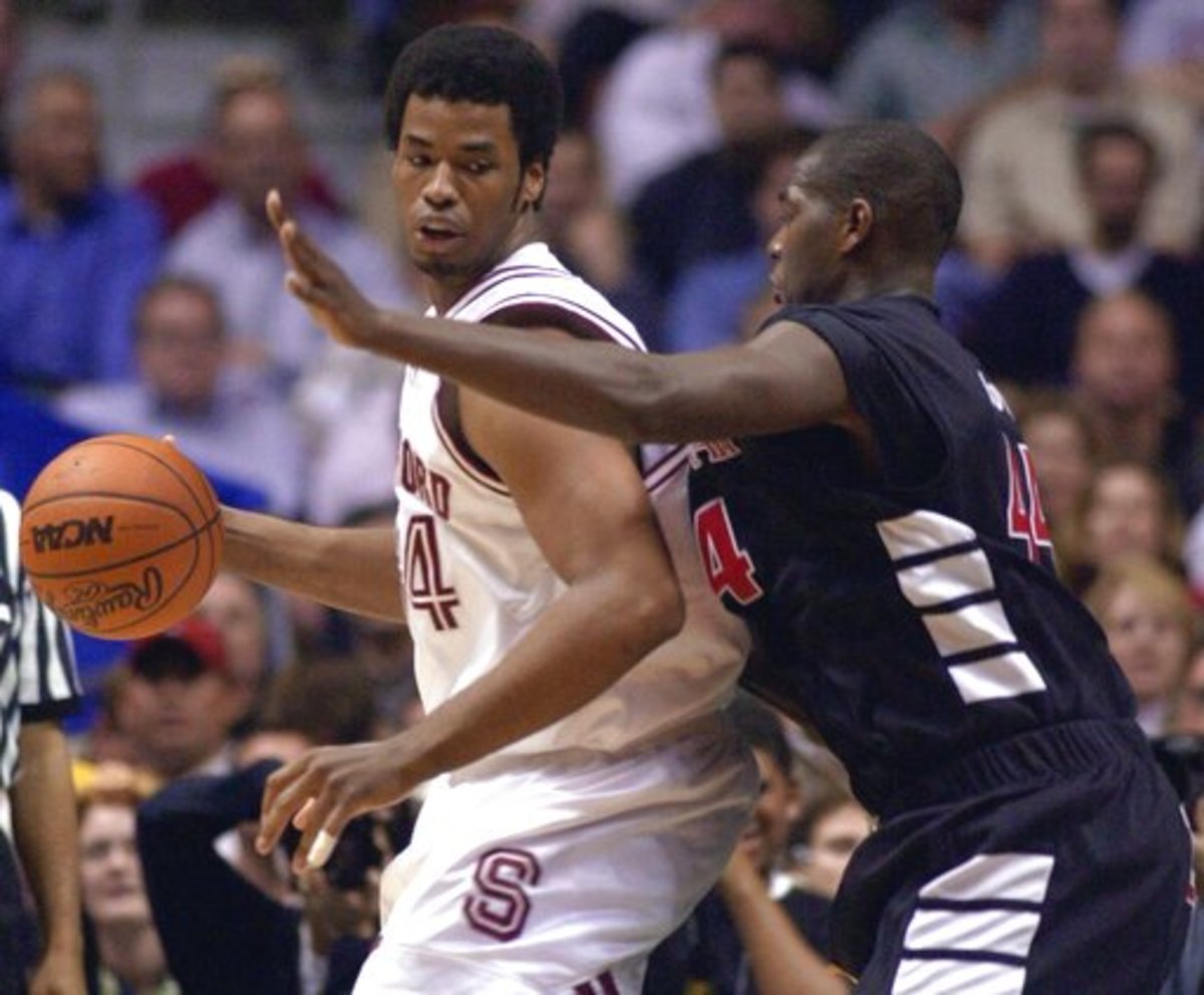 Stanford's Jason Collins drives past Cincinnati's B.J. Grove during the second half of their NCAA West Regional semifinal game at the Arrowhead Pond in Anaheim, Calif., Thursday, March 22, 2001.