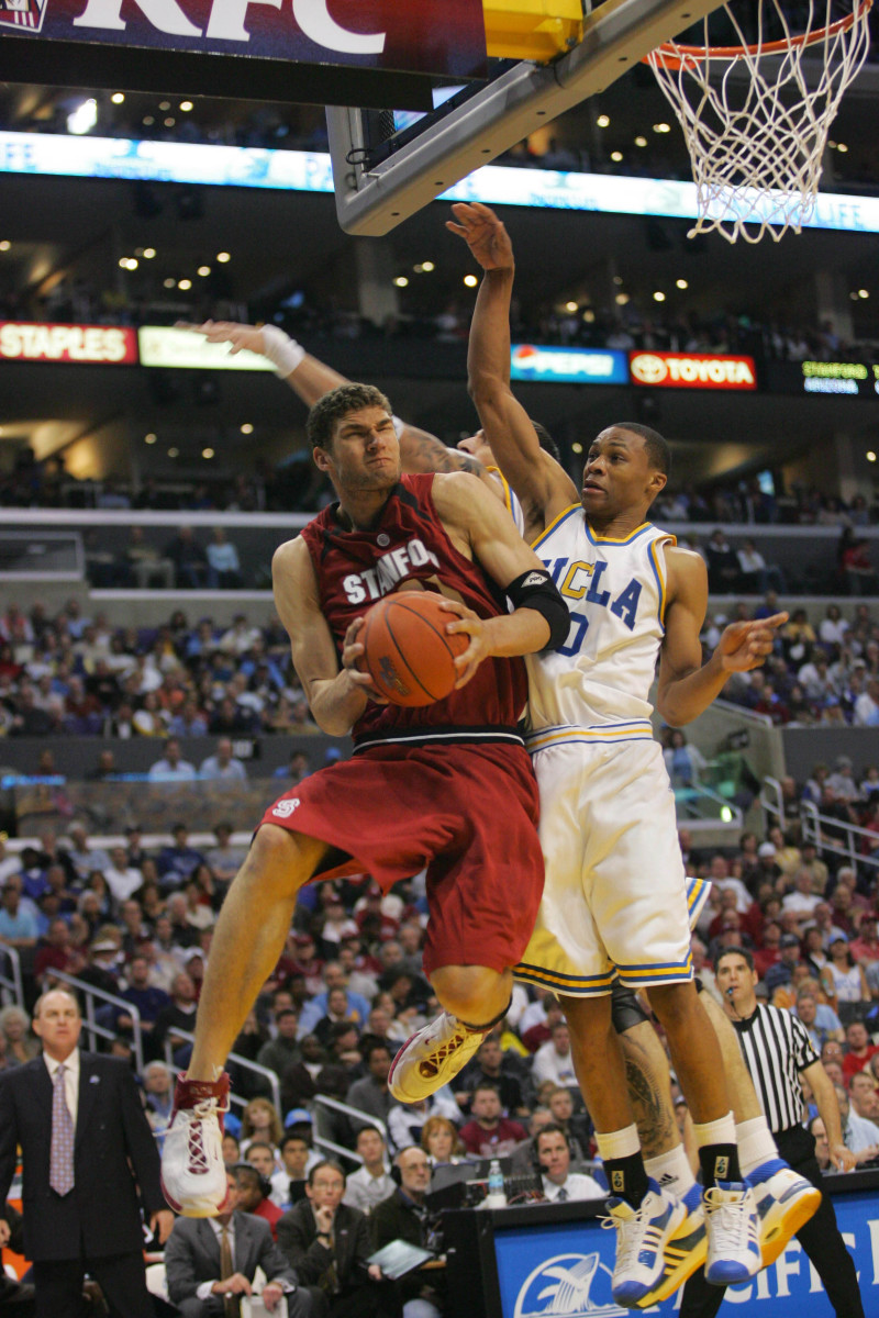 March 15, 2008; Los Angeles, CA, USA; Stanford Cardinal forward Brook Lopez (11) drives to the basket as he is defended by UCLA Bruins guard Russell Westbrook (0) in the first half during the championship game of the 2008 PAC-10 Mens Basketball Tourney at the Staples Center.
