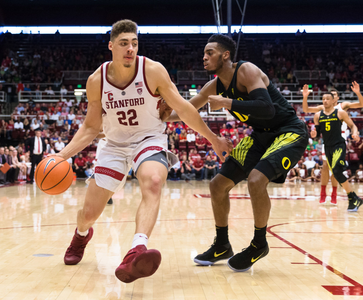 Feb 3, 2018; Stanford, CA, USA; Stanford Cardinal forward Reid Travis (22) dribbles against the Oregon Ducks in the first half at Maples Pavilion.