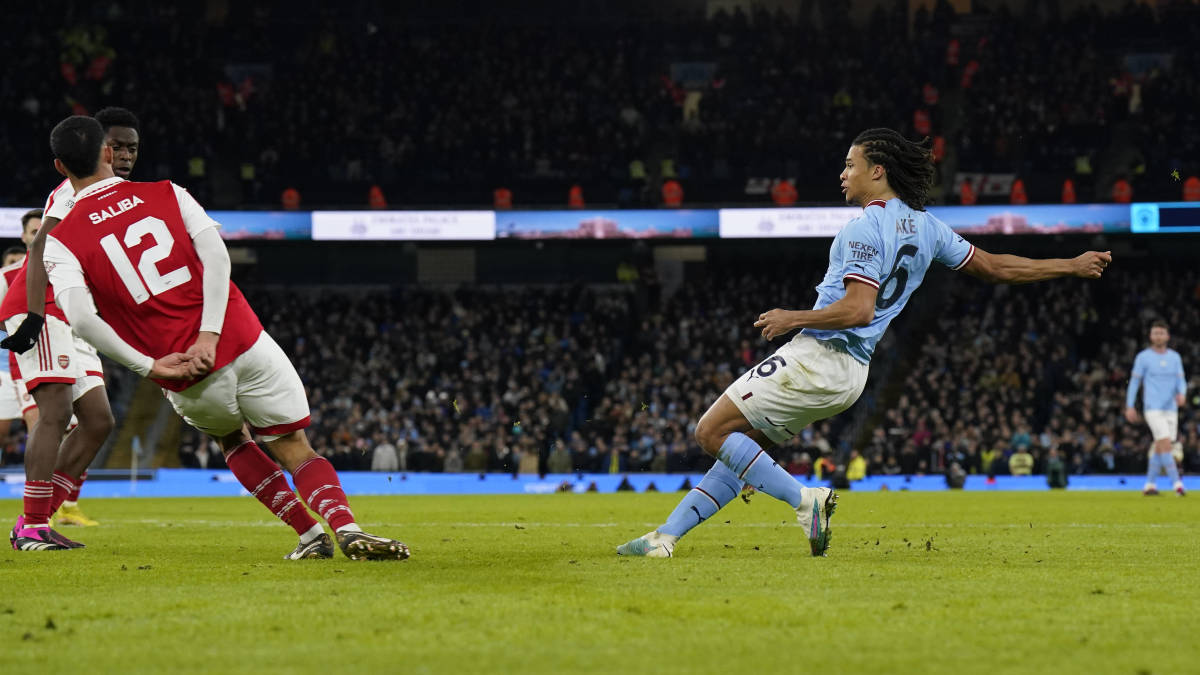 Nathan Ake pictured (right) scoring for Manchester City against Arsenal during a game in the fourth round of the 2022/23 FA Cup