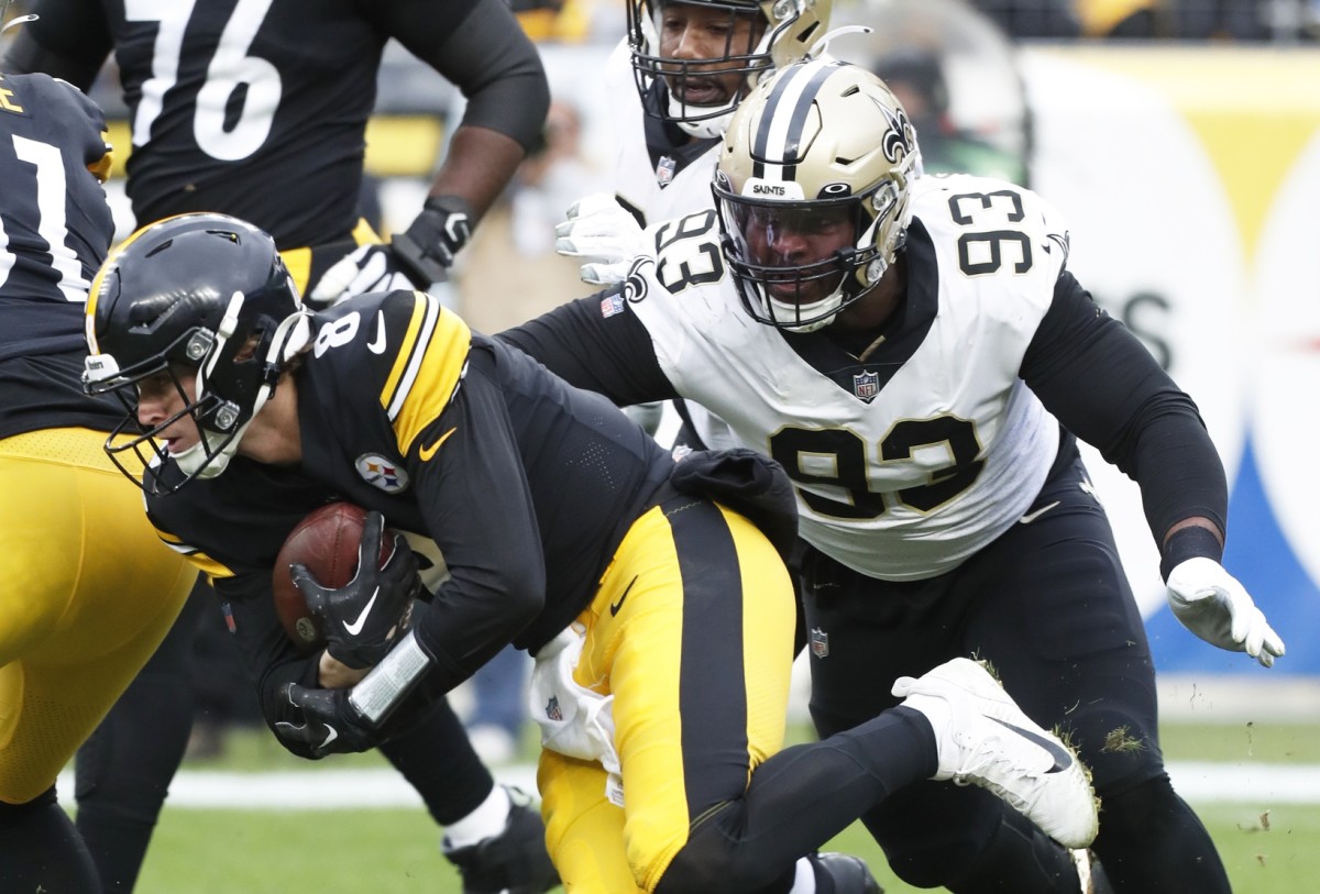 Pittsburgh Steelers quarterback Kenny Pickett (8) is brought down by New Orleans Saints defensive tackle David Onyemata (93). Mandatory Credit: Charles LeClaire-USA TODAY