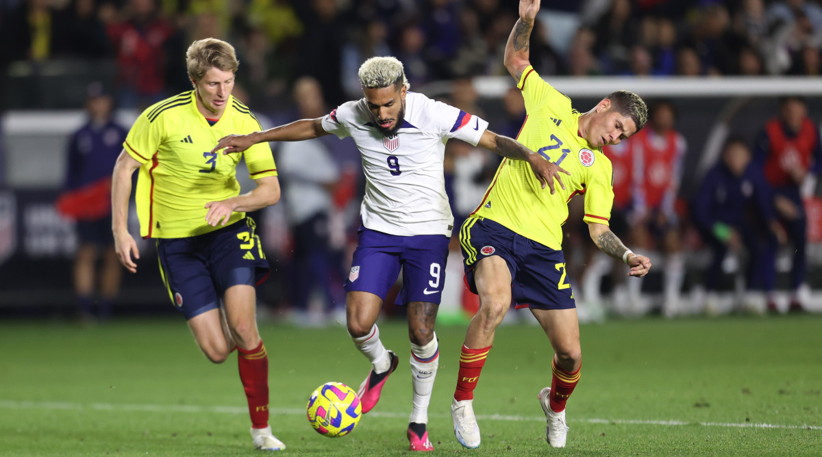 USMNT forward Jesús Ferreira battles Jorman Campuzano for the ball during an international friendly match against Colombia.