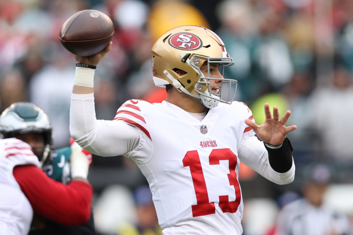 San Francisco quarterback Brock Purdy holds the ball, looking to throw before injuring his elbow in the first quarter against the Eagles in the NFC championship.