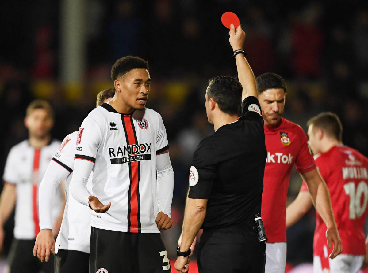 Sheffield United striker Daniel Jebbison pictured receiving a red card during his team's 3-3 draw at Wrexham in January 2023