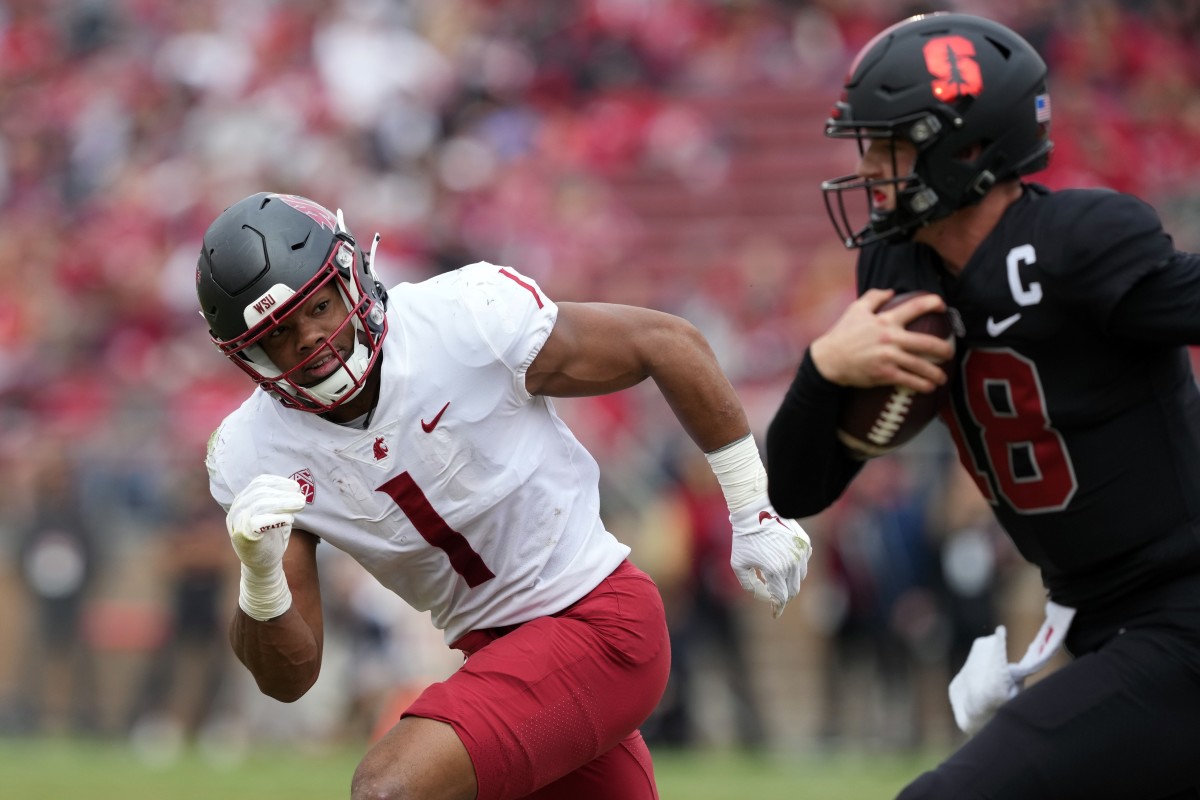 Nov 5, 2022; Stanford, California, USA; Washington State Cougars linebacker Daiyan Henley (1) pursues Stanford Cardinal quarterback Tanner McKee (18) during the second quarter at Stanford Stadium.