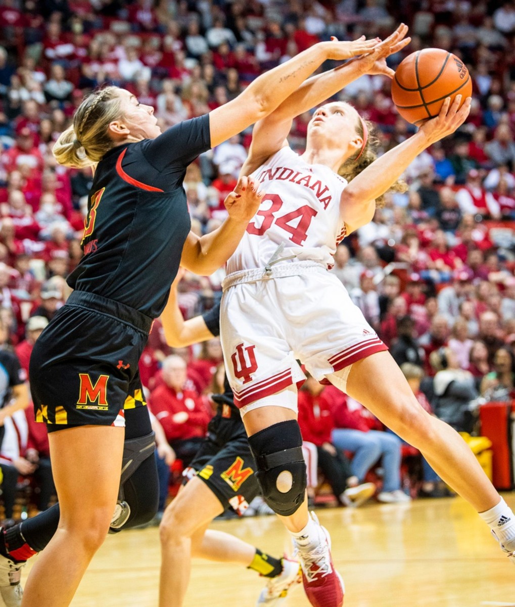 Indiana's Grace Berger (34) is fouled by Maryland's Faith Masonius (13) as she shoots during the second half of the Indiana versus Maryland women's basketball game at Simon Skjodt Assembly Hall on Thursday, Jan. 12, 2023.