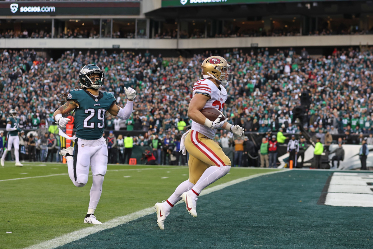 Philadelphia, Pennsylvania, USA; San Francisco 49ers running back Christian McCaffrey (23) scores a 23-yard touchdown run against the Philadelphia Eagles during the second quarter in the NFC Championship game at Lincoln Financial Field.