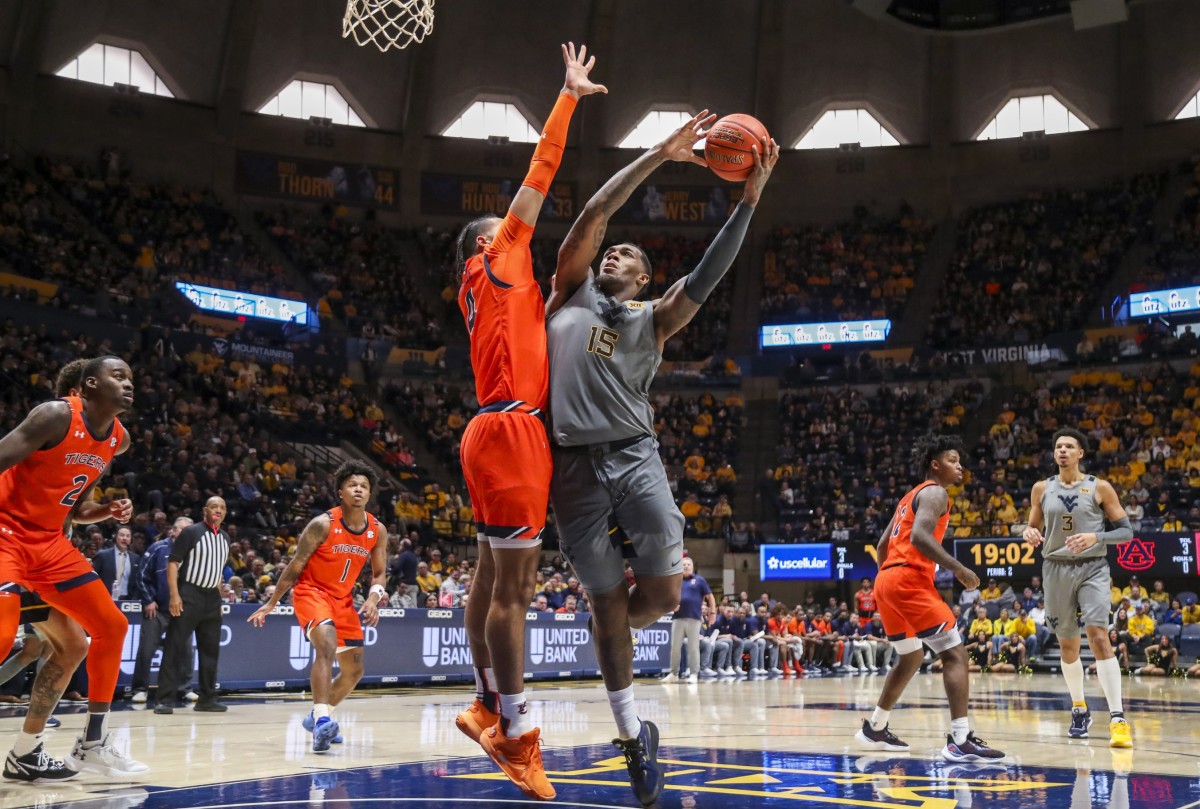 Jan 28, 2023; Morgantown, West Virginia, USA; West Virginia Mountaineers forward Jimmy Bell Jr. (15) shoots in the lane against Auburn Tigers forward Johni Broome (4) during the second half at WVU Coliseum.