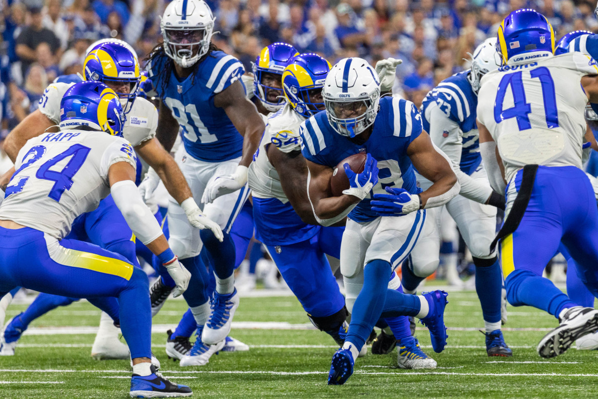 Sep 19, 2021; Indianapolis, Indiana, USA; Indianapolis Colts running back Jonathan Taylor (28) runs the ball in the first quarter against the Los Angeles Rams at Lucas Oil Stadium.