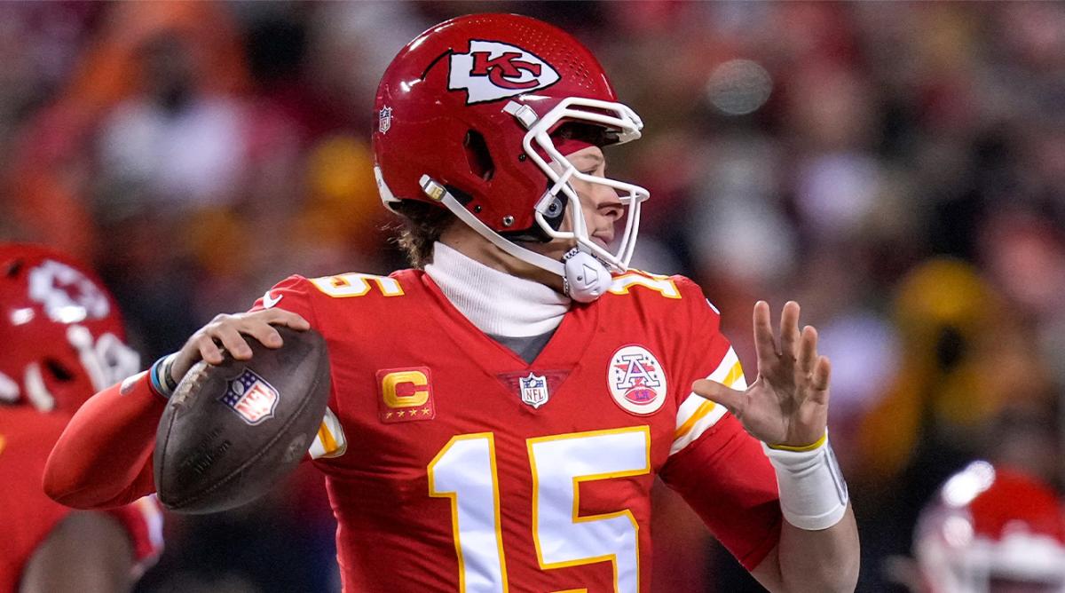 Chiefs quarterback Patrick Mahomes throws on the run in the first quarter.